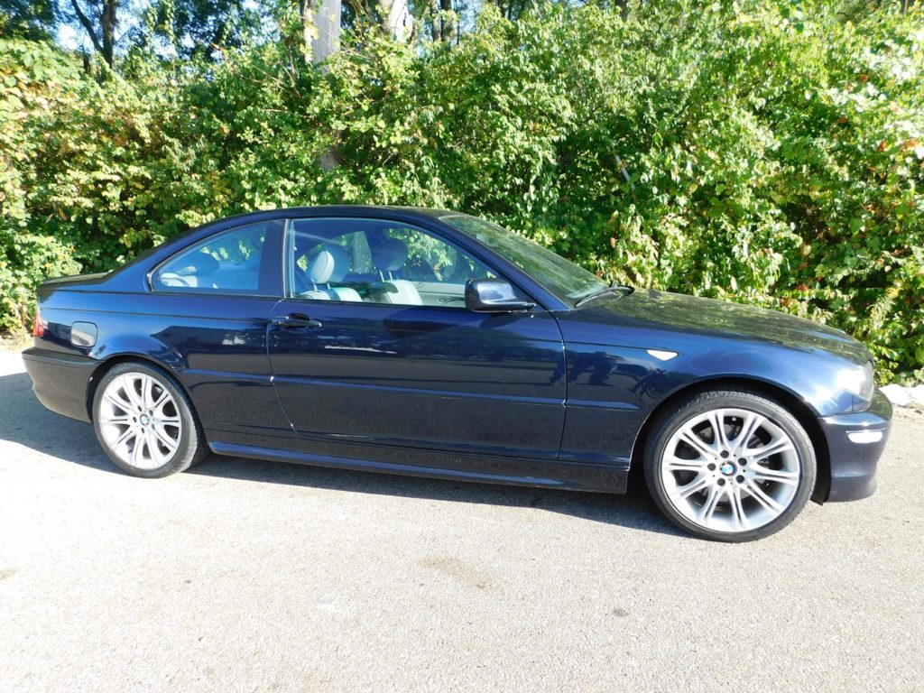 Side view of Navy 2005 BMW 330 Ci At Goodwill Auto Auction