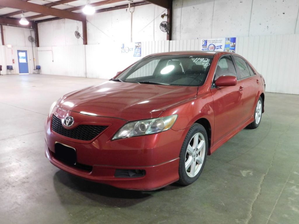Front view of Red 2007 Toyota Camry at Goodwill Auto Auction