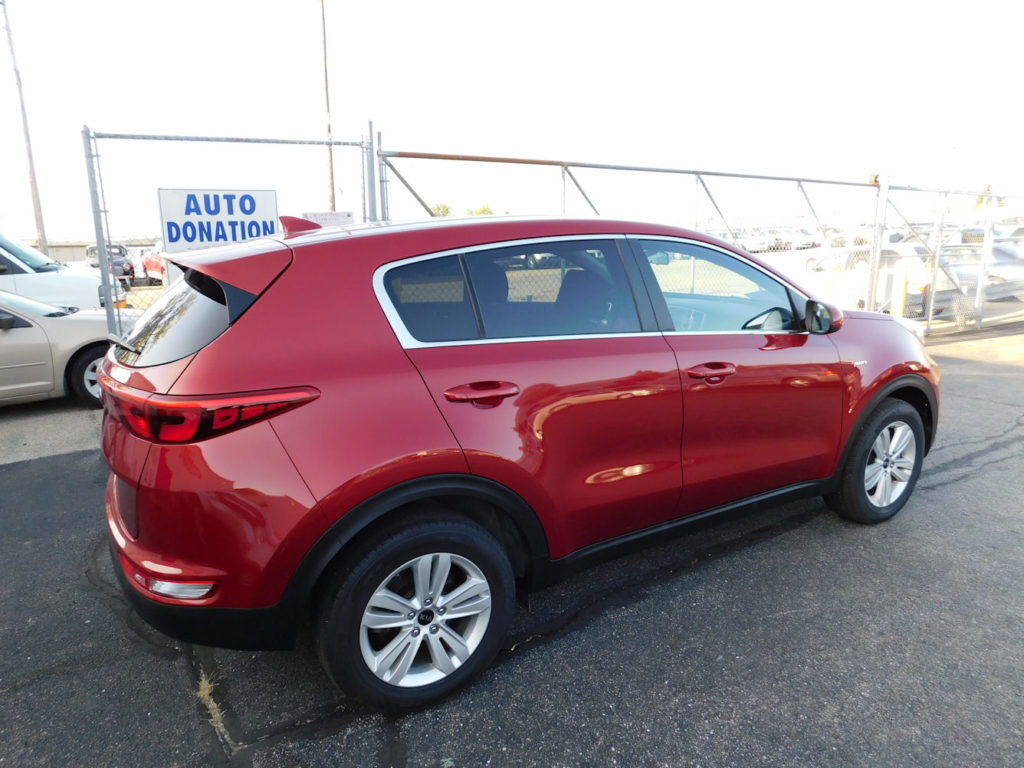 Red 2018 Kia Sportage LX Side at Ohio Valley Goodwill